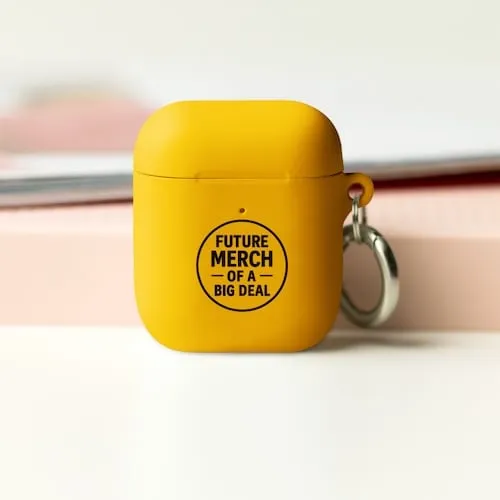 A yellow Airpods case with black text that says Future Merch of a Big Deal representing tech accessory promotional products available in our store for same-day online ordering in Dallas .